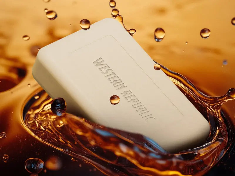 Moisturizing bar soap from Western Republic submerged in water, highlighting its rich hydrating formula.