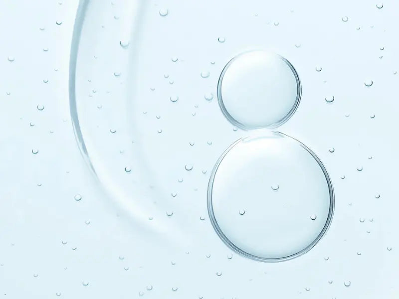 Niacinamide for sensitive skin shown in a clear serum texture with hydrating microbubbles and smooth consistency.